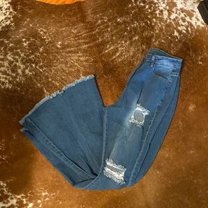 Women’s distressed bell bottoms, medium wash